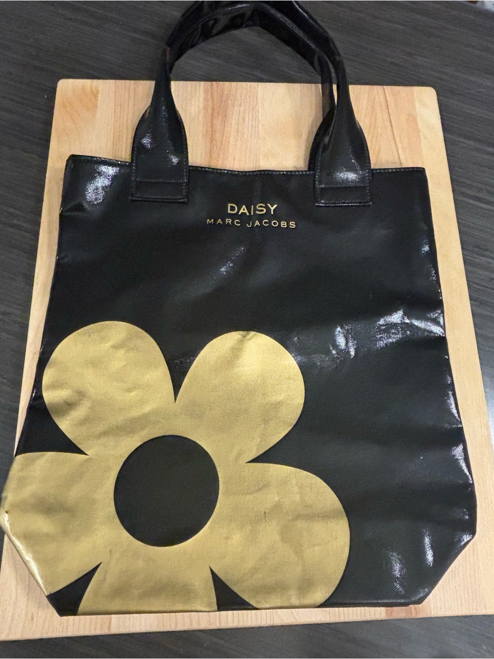 Marc Jacobs Black Tote with Gold Daisy Graphic
